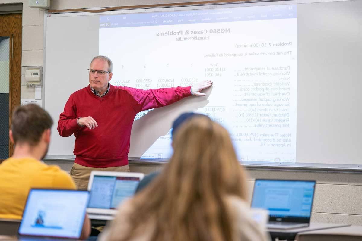 Professor lecturing at hte board